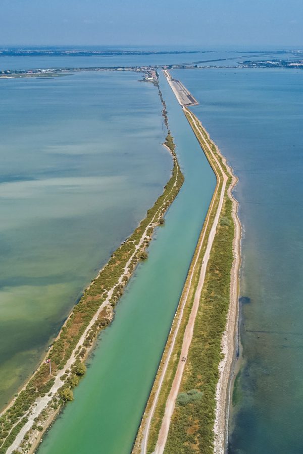 aerial-view-of-canal-in-lagoon-of-mediterranean-sea-etang-de-thau-water-from-above-south-france